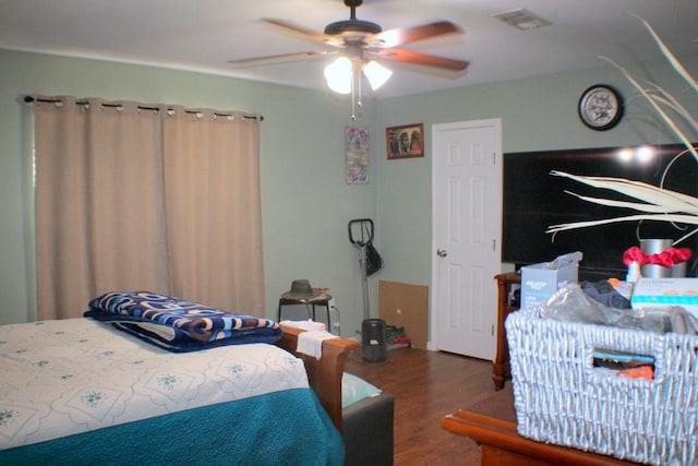 7721 Brumblay St, Houston, TX 77012 - bedroom with visible vents, wood finished floors, and ceiling fan