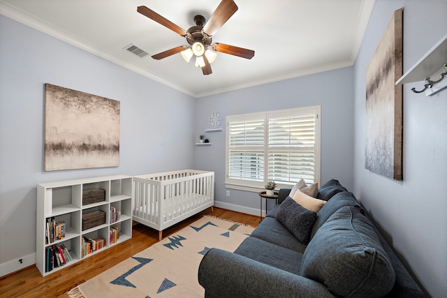 1538 Dorothy St, Houston, TX 77008 - bedroom with crown molding, wood finished floors, ceiling fan, and baseboards