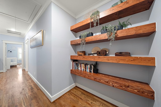 1538 Dorothy St, Houston, TX 77008 - corridor featuring attic access, wood finished floors, baseboards, and ornamental molding