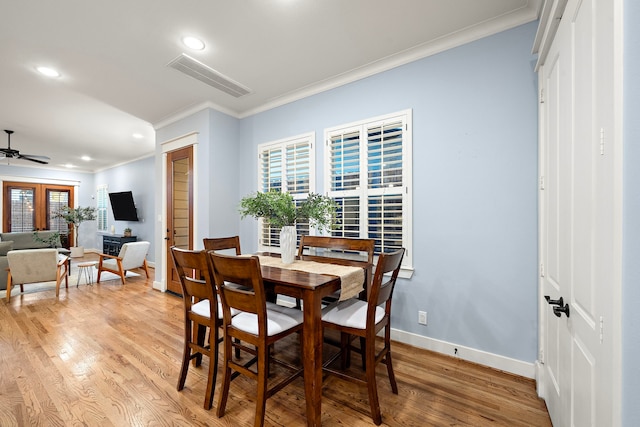 dining area featuring recessed lighting, visible vents, ornamental molding, and light wood-style floors