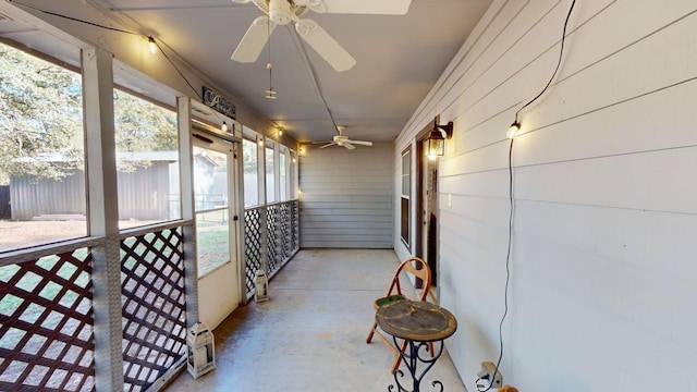 sunroom featuring ceiling fan