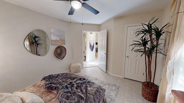 bedroom featuring light tile patterned flooring, ceiling fan, and baseboards