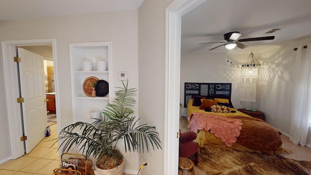 bedroom featuring visible vents, ceiling fan, and light tile patterned flooring