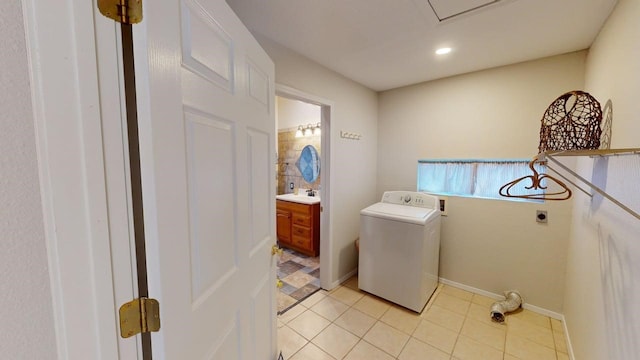 laundry room featuring laundry area, washer / dryer, recessed lighting, a sink, and light tile patterned floors