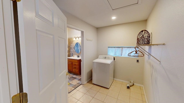 laundry area featuring laundry area, washer / clothes dryer, a sink, light tile patterned floors, and recessed lighting