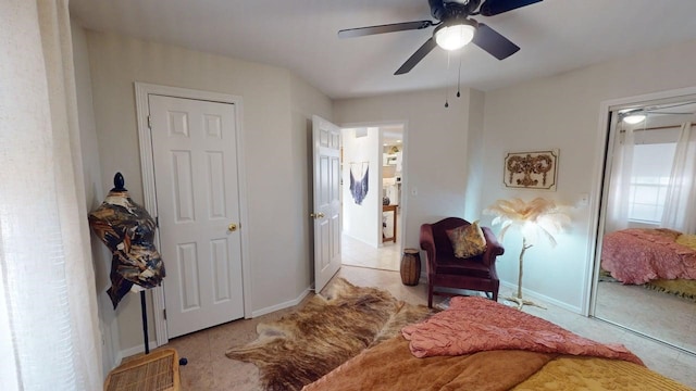 sitting room featuring baseboards, tile patterned flooring, and a ceiling fan