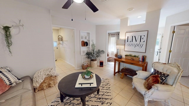 living room with ceiling fan and light tile patterned floors