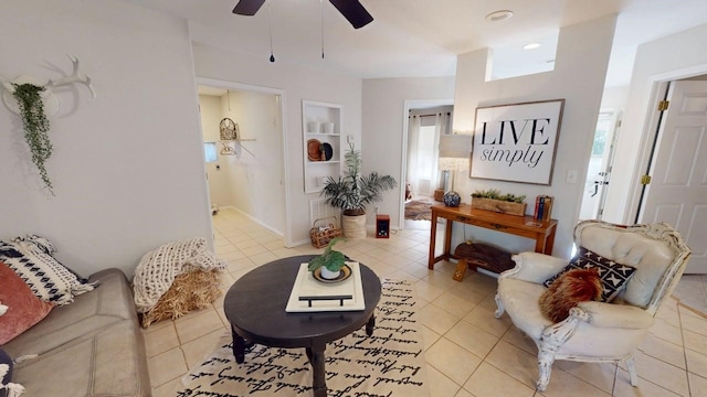 living room with ceiling fan and light tile patterned floors