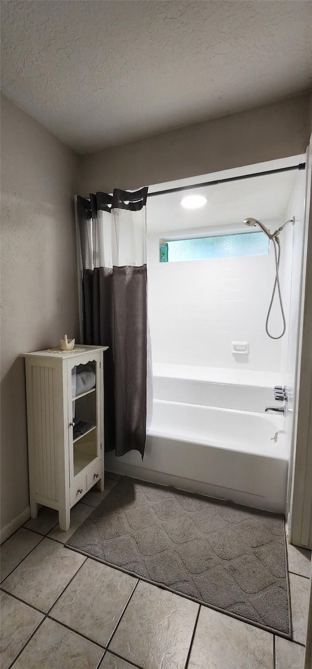 532 S Rivershire Dr, Conroe, TX 77304 - full bath featuring shower / bathtub combination with curtain, tile patterned floors, and a textured ceiling
