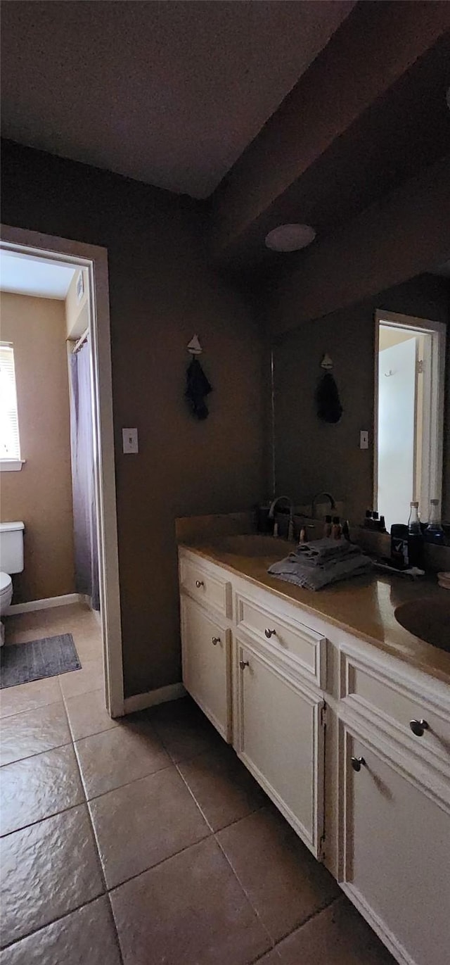 532 S Rivershire Dr, Conroe, TX 77304 - full bath featuring tile patterned flooring, double vanity, and toilet
