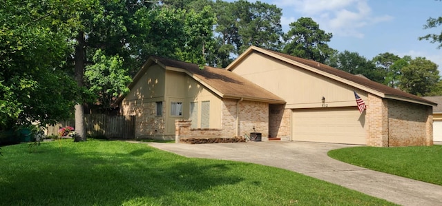 532 S Rivershire Dr, Conroe, TX 77304 - view of front facade featuring an attached garage, brick siding, and concrete driveway