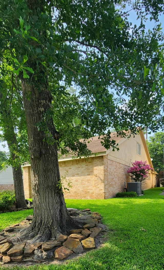 532 S Rivershire Dr, Conroe, TX 77304 - view of grassy yard with central AC