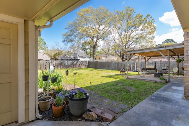 view of yard with a fenced backyard and a patio area