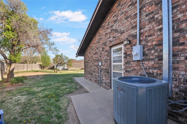 view of yard with fence and cooling unit