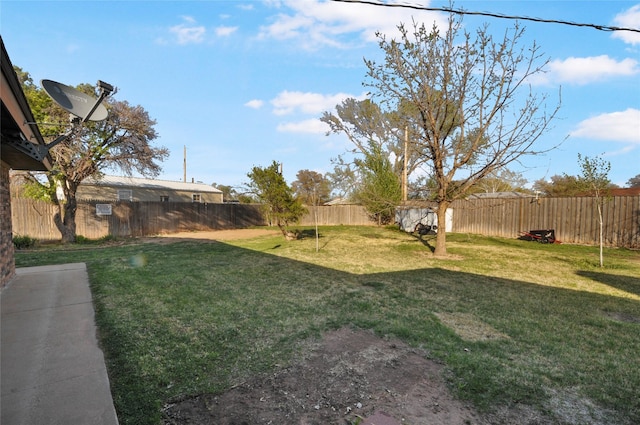 view of yard with a fenced backyard