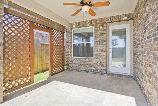 view of patio / terrace featuring fence and a ceiling fan