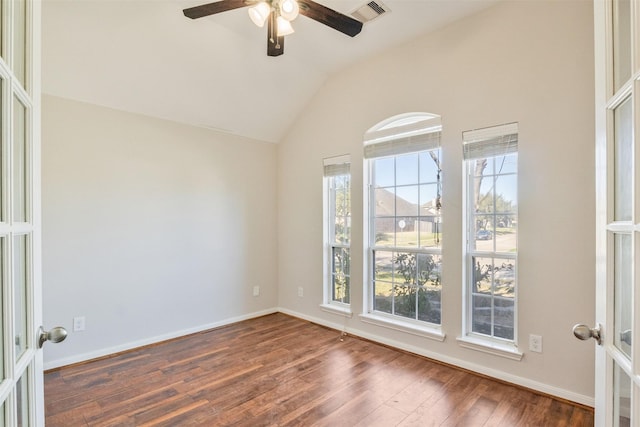 spare room featuring a ceiling fan, french doors, visible vents, wood-type flooring, and lofted ceiling
