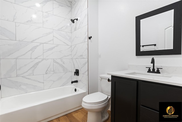 full bathroom with vanity,  shower combination, wood finished floors, and toilet