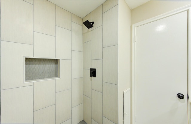 bathroom with tiled shower