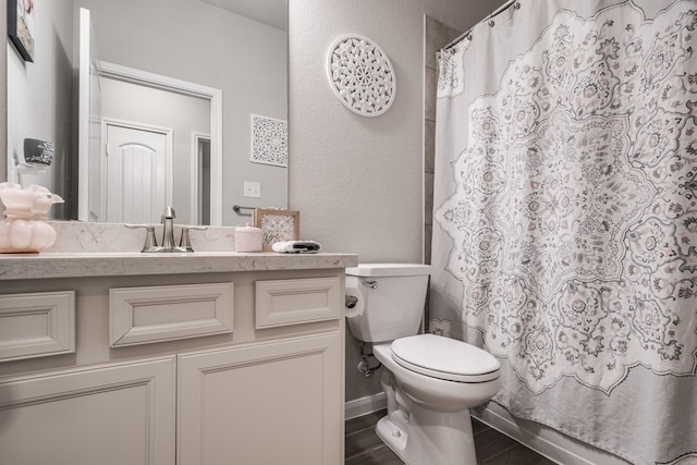 full bathroom with a shower with shower curtain, toilet, wood finished floors, and vanity