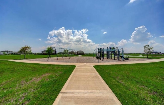 view of community featuring a lawn and playground community