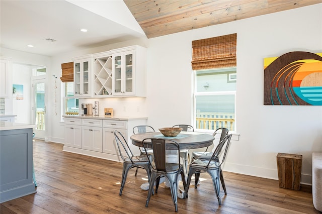 dining area featuring plenty of natural light, recessed lighting, wood-type flooring, and baseboards