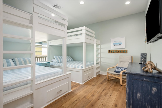 bedroom with recessed lighting, baseboards, visible vents, and light wood finished floors