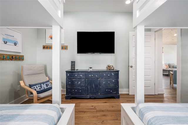 bedroom featuring light wood-type flooring and baseboards