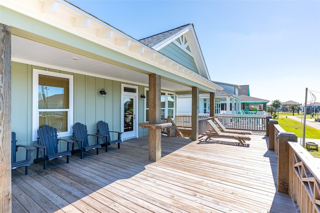 wooden deck with a residential view