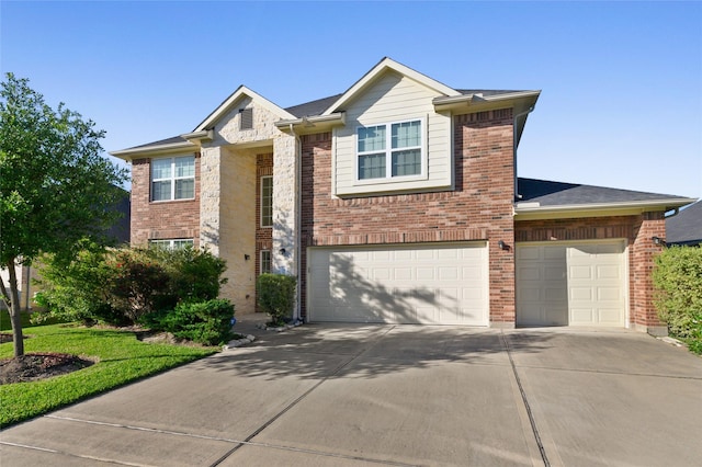 24618 Malca Manor Dr, Katy, TX 77493 - view of front facade featuring concrete driveway, brick siding, and a garage