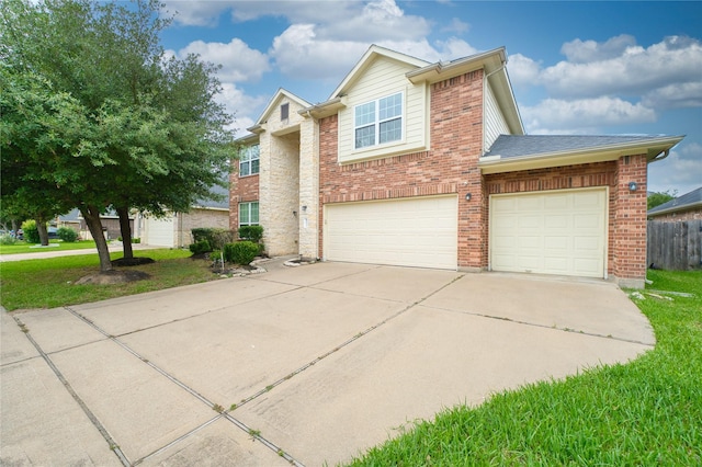 24618 Malca Manor Dr, Katy, TX 77493 - traditional home featuring brick siding, an attached garage, fence, and concrete driveway