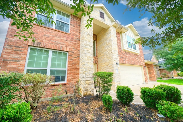 24618 Malca Manor Dr, Katy, TX 77493 - view of front of house with concrete driveway, brick siding, and an attached garage