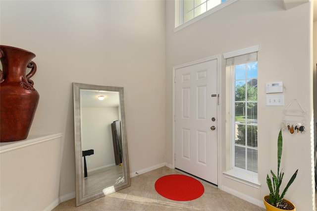 24618 Malca Manor Dr, Katy, TX 77493 - foyer with baseboards, plenty of natural light, tile patterned floors, and a towering ceiling