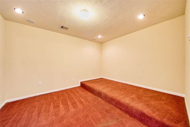 24618 Malca Manor Dr, Katy, TX 77493 - carpeted empty room featuring baseboards, recessed lighting, a textured ceiling, and visible vents