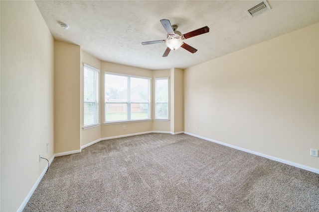 24618 Malca Manor Dr, Katy, TX 77493 - carpeted empty room featuring baseboards, a ceiling fan, a textured ceiling, and visible vents