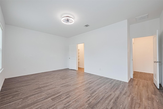 12518 Pelican Bay Dr, Houston, TX 77038 - spare room with visible vents, baseboards, and wood finished floors