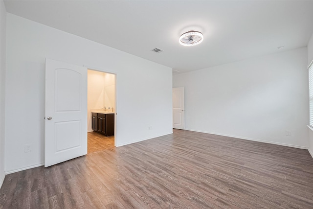 12518 Pelican Bay Dr, Houston, TX 77038 - interior space featuring visible vents, baseboards, and wood finished floors