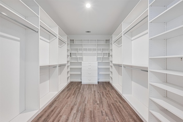 12518 Pelican Bay Dr, Houston, TX 77038 - spacious closet featuring wood finished floors and visible vents