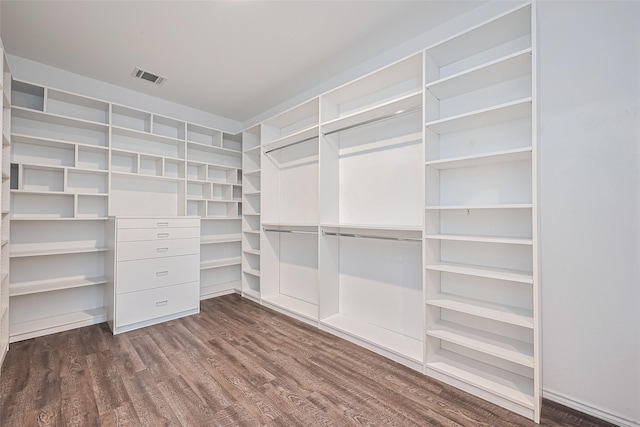 12518 Pelican Bay Dr, Houston, TX 77038 - walk in closet with dark wood-style flooring and visible vents