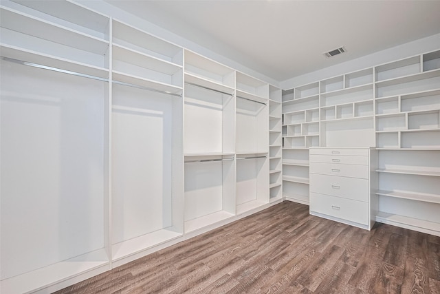 12518 Pelican Bay Dr, Houston, TX 77038 - spacious closet featuring visible vents and dark wood finished floors