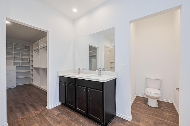 12518 Pelican Bay Dr, Houston, TX 77038 - full bathroom with a sink, a walk in closet, and wood finished floors
