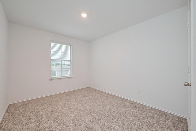 12518 Pelican Bay Dr, Houston, TX 77038 - carpeted empty room with baseboards and recessed lighting