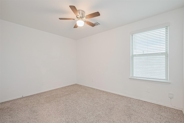 12518 Pelican Bay Dr, Houston, TX 77038 - empty room featuring baseboards, carpet, ceiling fan, and a wealth of natural light