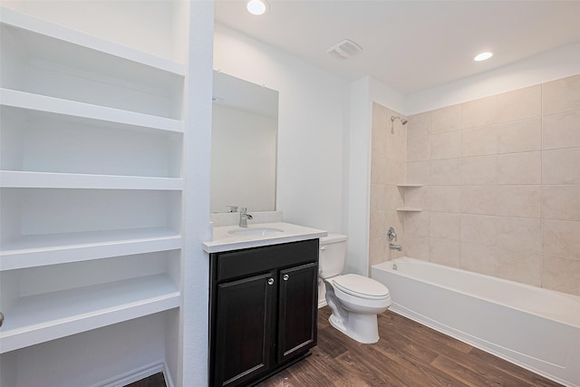 12518 Pelican Bay Dr, Houston, TX 77038 - full bath with vanity, shower / bathtub combination, toilet, wood finished floors, and visible vents
