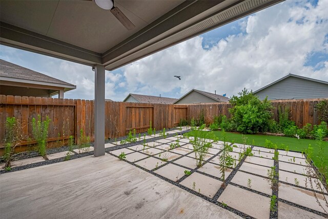 12518 Pelican Bay Dr, Houston, TX 77038 - view of patio / terrace with a ceiling fan and a fenced backyard
