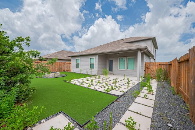 12518 Pelican Bay Dr, Houston, TX 77038 - back of property featuring a patio, a fenced backyard, roof with shingles, and a yard
