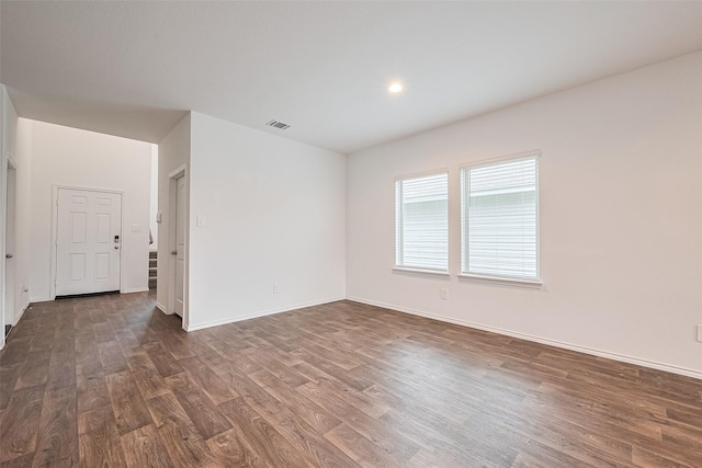 12518 Pelican Bay Dr, Houston, TX 77038 - empty room with baseboards, dark wood-style floors, and visible vents