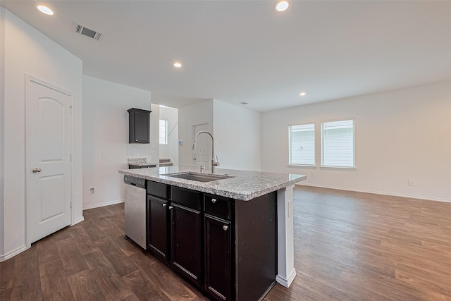 12518 Pelican Bay Dr, Houston, TX 77038 - kitchen featuring a sink, dishwasher, a kitchen island with sink, wood finished floors, and visible vents