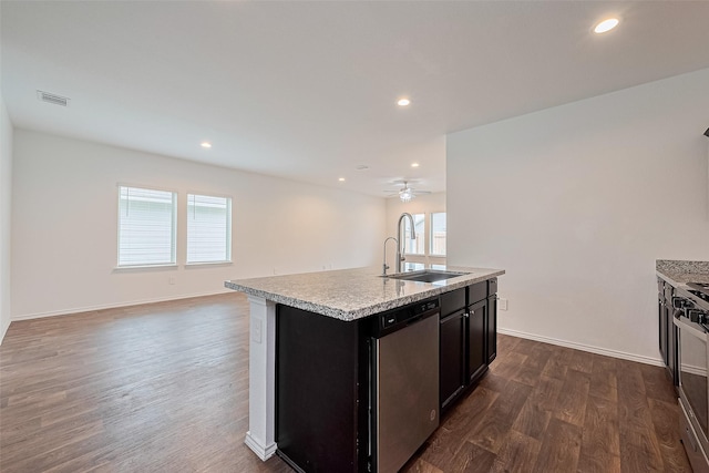 12518 Pelican Bay Dr, Houston, TX 77038 - kitchen featuring dark wood-style flooring, appliances with stainless steel finishes, a sink, light countertops, and open floor plan