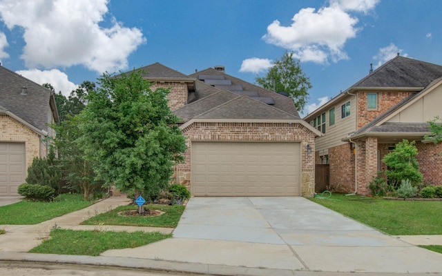 view of front of home with brick siding, a garage, roof with shingles, and concrete driveway